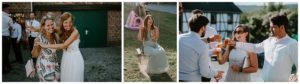 Freunde lachen, umarmen sich herzlich und stoßen bei einer Hochzeit im Freien an – Hochzeitsreportage NRW.